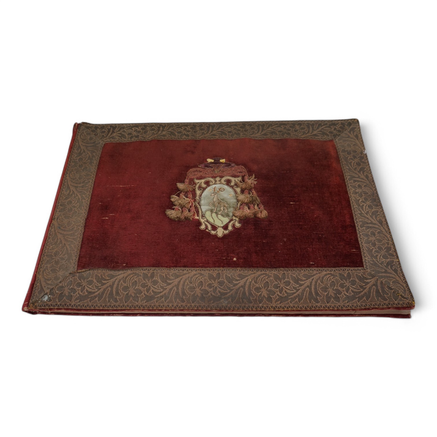 A 19th century embroidered blotter with stag crest, 57cm wide. Condition - fair